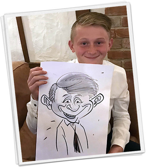 caricature in the school hall a cheeky boy holds his papered caricature