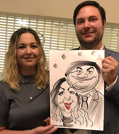 couple are smiling in their cartoon couple smiley faces in their caricature