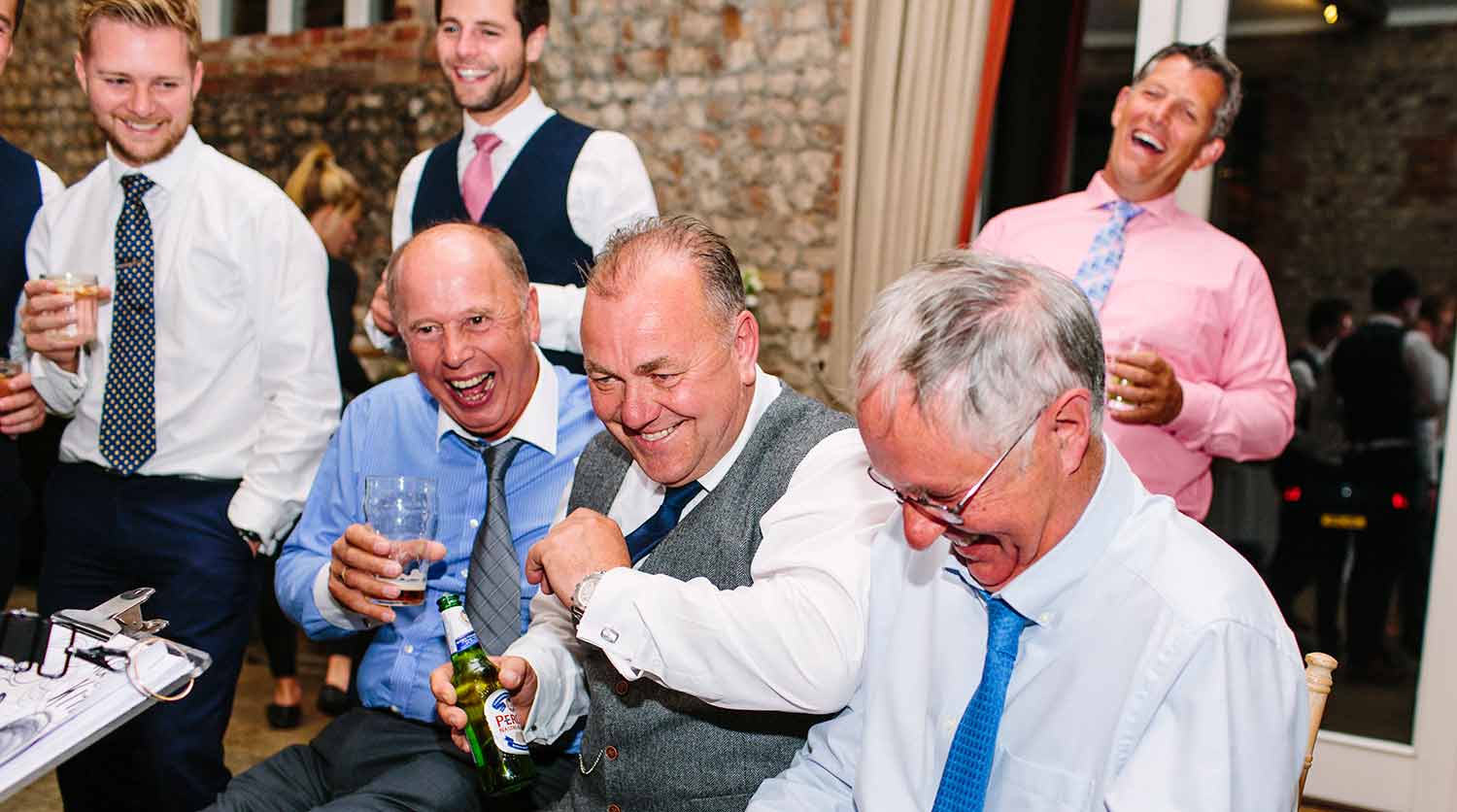 bunch of men laughing at their caricature group of men laughing at their caricature in Farbridge Barn