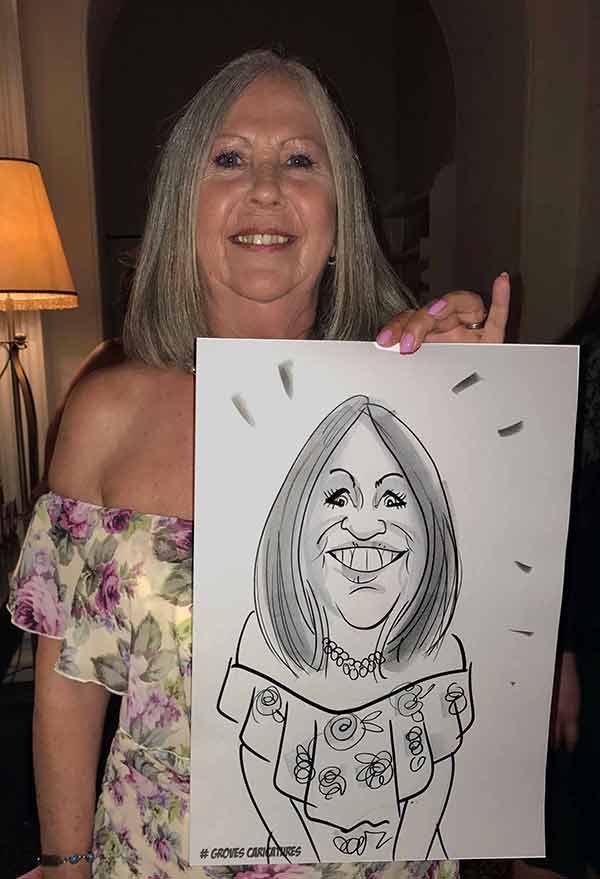 lady get a caricature at a summer party in surrey somewhere lady likes his caricature