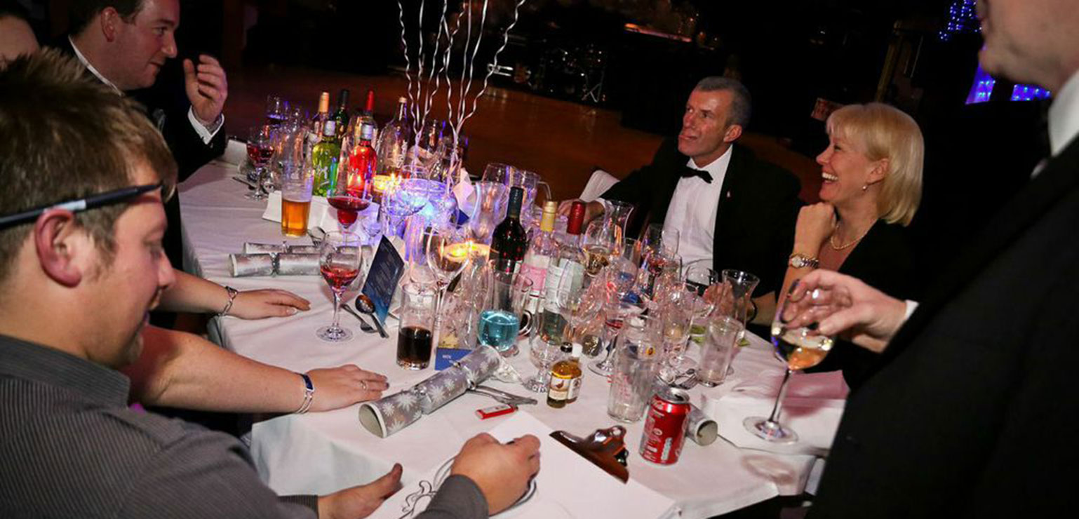 Pulling crackers and getting a caricature over Military Christmas Ball