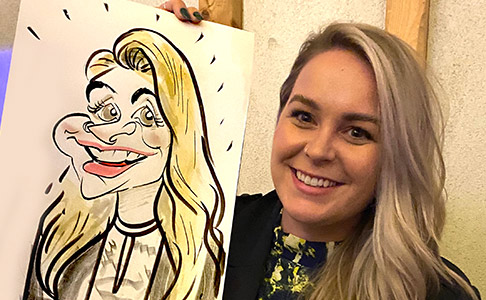 Shelia with her caricature Shelia reactions to her caricature